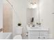 Neutral toned bathroom featuring tile shower and white vanity at 3748 Ellington St, Charlotte, NC 28211