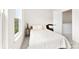 Bright bedroom featuring a window and neutral-toned decor and carpet at 3748 Ellington St, Charlotte, NC 28211