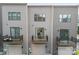Townhome with gray siding featuring a garage and a small balcony at 3748 Ellington St, Charlotte, NC 28211