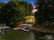 Waterfront home with deck, dock, boat lift and beautiful twilight view at 4120 Lake Shore S Rd, Denver, NC 28037