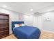 Cozy bedroom featuring light-colored walls, wood-look flooring, and a double door closet for convenient storage at 4120 Lake Shore S Rd, Denver, NC 28037
