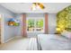 Comfortable bedroom with large window letting in natural light and view of outdoor deck at 4120 Lake Shore S Rd, Denver, NC 28037