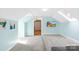 Upstairs bonus room with a view of a tv, open doorway, and natural lighting at 4120 Lake Shore S Rd, Denver, NC 28037