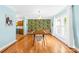 Dining room featuring stylish wallpaper and natural light from the window at 4120 Lake Shore S Rd, Denver, NC 28037