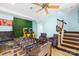 A game room featuring foosball table, arcade games, an accent wall and staircase at 4120 Lake Shore S Rd, Denver, NC 28037