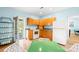 Well-lit kitchen with wooden cabinets, white appliances, and a view of the outdoor scenery at 4120 Lake Shore S Rd, Denver, NC 28037