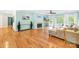 Spacious living room with fireplace, ceiling fan, and view of the outdoor deck at 4120 Lake Shore S Rd, Denver, NC 28037