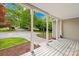 Covered front porch features white pillars and views of the landscaped front yard at 4120 Lake Shore S Rd, Denver, NC 28037