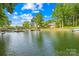 Picturesque waterfront view showcasing the tranquil lake, private boat docks and neighboring homes at 4120 Lake Shore S Rd, Denver, NC 28037