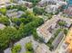 Overhead view of apartment complex showcasing well-manicured green spaces, tree coverage, and proximity to Charlotte City Center at 415 W 7Th St # H, Charlotte, NC 28202