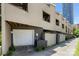 Exterior townhome view with attached single garage, neutral siding, and close proximity to downtown amenities at 415 W 7Th St # H, Charlotte, NC 28202