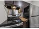 Kitchen featuring stainless steel appliances and granite countertops at 415 W 7Th St # H, Charlotte, NC 28202