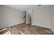 Unfurnished living room with hardwood floors and stairs at 415 W 7Th St # H, Charlotte, NC 28202