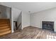 Living room featuring hardwood floors and a fireplace at 415 W 7Th St # H, Charlotte, NC 28202