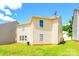 Large, green backyard with the exterior view of the two-story home, creating an inviting outdoor space at 4521 Palustris Ct, Charlotte, NC 28269
