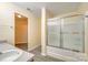 Bright bathroom featuring a sink, shower with glass doors, and sleek gray flooring at 4521 Palustris Ct, Charlotte, NC 28269