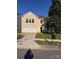 Charming two-story home with a two-car garage, a large driveway, and a well-maintained lawn at 4521 Palustris Ct, Charlotte, NC 28269
