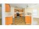 Kitchen with wood cabinets, laminate countertops, ceramic tile floors, and stainless steel appliances at 4521 Palustris Ct, Charlotte, NC 28269