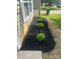 Beautifully landscaped garden bed with lush greenery and dark mulch, enhancing the home's curb appeal at 4521 Palustris Ct, Charlotte, NC 28269