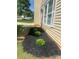 Well-maintained landscaping with fresh mulch and manicured bushes accentuating the home's exterior at 4521 Palustris Ct, Charlotte, NC 28269