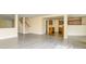 Open-concept living space with gray wood-look flooring and seamless flow into the kitchen at 4521 Palustris Ct, Charlotte, NC 28269