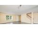 Inviting living room features gray wood-look floors, a staircase, and natural light at 4521 Palustris Ct, Charlotte, NC 28269