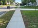 A peaceful neighborhood street with well-maintained sidewalks and inviting curb appeal on a sunny day at 4521 Palustris Ct, Charlotte, NC 28269