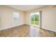 Sunny sunroom with ceramic tile flooring and a sliding glass door to the backyard at 4521 Palustris Ct, Charlotte, NC 28269