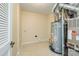 The utility room features a modern hot water heater on tile flooring at 4521 Palustris Ct, Charlotte, NC 28269