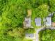 Aerial view of home featuring mature trees, fenced in backyard and private setting at 485 Lincoln St, Cramerton, NC 28032