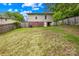 Spacious backyard with green grass and a partial fence view of the home's exterior at 485 Lincoln St, Cramerton, NC 28032