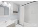 Clean bathroom featuring a single vanity, toilet, and shower with tub at 485 Lincoln St, Cramerton, NC 28032