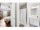 Bathroom featuring a vanity, toilet, walk in shower, with a view of the bedroom at 485 Lincoln St, Cramerton, NC 28032