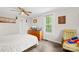 Inviting bedroom with hardwood floors, natural light from a bright window, and vintage decor at 485 Lincoln St, Cramerton, NC 28032
