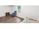 Cozy bedroom with hardwood floors, natural light from a window, and neutral walls at 485 Lincoln St, Cramerton, NC 28032