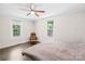 Spacious bedroom with hardwood floors, a large window, and an additional reading space for extra comfort at 485 Lincoln St, Cramerton, NC 28032