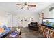 Cozy living room featuring a ceiling fan and hardwood floors at 485 Lincoln St, Cramerton, NC 28032