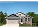Charming two-story home featuring a stone facade, attached garage, and well-manicured lawn at 577 Nesbe St # 2222, Lancaster, SC 29720