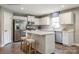 Bright kitchen featuring white cabinets, stainless steel appliances, and a center island with seating at 577 Nesbe St # 2222, Lancaster, SC 29720