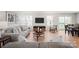 Inviting living room featuring neutral tones, and an open layout leading to a dining area and sliding glass doors at 577 Nesbe St # 2222, Lancaster, SC 29720