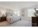 Serene main bedroom featuring plush carpeting, neutral décor, and natural light from two large windows at 577 Nesbe St # 2222, Lancaster, SC 29720
