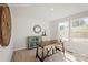 Bright home office featuring a wooden desk, cabinet, and wall decorations adjacent to sunlit windows at 577 Nesbe St # 2222, Lancaster, SC 29720