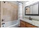 Bathroom featuring a granite topped vanity, shower/tub combo, and neutral tile at 6211 Cruden Bay Way, Charlotte, NC 28277