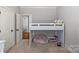 bedroom with a loft bed, stuffed beanbag and an open door leading to another room at 6211 Cruden Bay Way, Charlotte, NC 28277