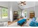 Inviting living room with a fireplace, plush seating, and views of the outdoor landscape at 6211 Cruden Bay Way, Charlotte, NC 28277