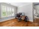 Home office featuring wood floors, natural light, and a dedicated workspace at 6211 Cruden Bay Way, Charlotte, NC 28277