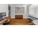 Office space with wood floors, vintage cabinet, and large window offering bright, natural light at 6211 Cruden Bay Way, Charlotte, NC 28277