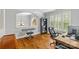 Charming office space with hardwood floors, built-in shelving, and natural light at 6211 Cruden Bay Way, Charlotte, NC 28277
