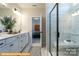Elegant bathroom boasting marble countertops, a glass-enclosed shower, and modern fixtures at 6336 Busch Ave, Midland, NC 28107
