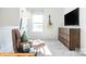 Relaxing bonus room highlighting a plush chaise lounge, TV, and a guitar on the wall at 6336 Busch Ave, Midland, NC 28107